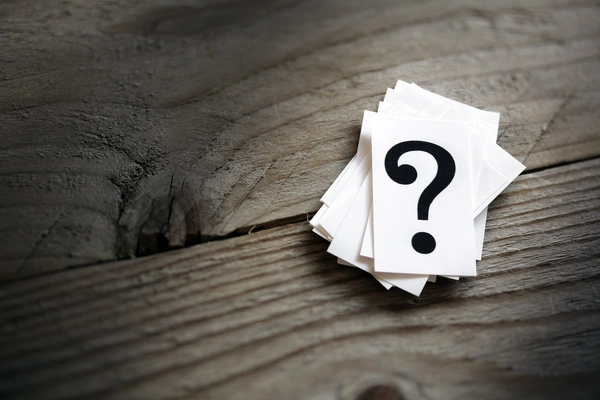 Question Cards on Wooden Table